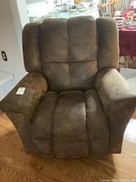 Front view of brown Lazy Boy recliner chair showing plush cushioned seat, backrest, and armrests.