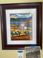 Framed print titled “Summer Fields” showing hillside landscape with white house and colored fields.