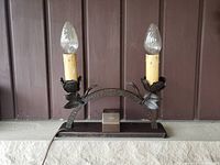 Full lamp unlit photo showing details of bulbs, candle sleeves, floral holders and hammered copper base.