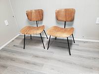 Two chairs front view on floor showing full design