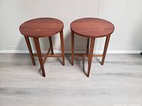 Pair of teak side tables upright, front view showing overall shape and finish