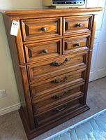 Front view of the six drawer tallboy dresser showing drawer details and handles.