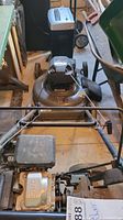 Front view of the Craftsman lawn mower showing wheels, pulling rope, and deck.