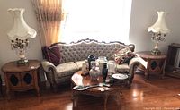 Both side tables placed in a living room with sofa and lamps, showing overall style and condition