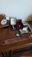 Overview of all items including clock, wristwatches, pocket watches, sharpening belt and watch accessories