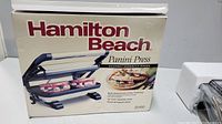 Front view of the Hamilton Beach Panini Press box showing the product image and branding.