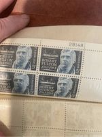 Block of four Robert Fulton 5-cent stamps in black and white with plate number 28148