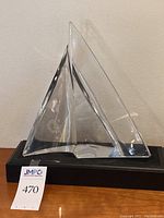 Front view of Baccarat crystal sail sculpture with CalPine logo on black base