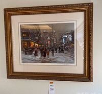 Framed signed print hung on wall showing entire artwork with frame and matting.