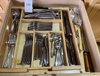 Overall view of wooden tray insert showing full assortment of flatware and accessories