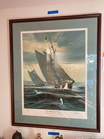 Full view of framed lithograph depicting two sailboats on the water titled 'The Mastheadman'