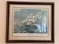 Framed lithograph showing Flying Cloud under sail with mat and frame