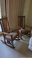 Pair of craftsman style rocking chairs positioned side by side