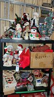 Four-tier shelving holding various ornaments, figurines and trees