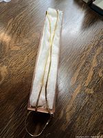 Chain laid inside presentation box on white padding