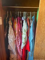 Wardrobe view showing multiple dresses hung on hangers