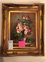Photo showing full view of ornately framed oil painting of pink and white roses signed Jaffe