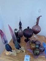 Lot overview: two decorative glass pheasants, three decanters, covered candy dish, fluted bowl with blown glass spheres