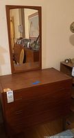 Dresser with mirror assembly front view in room