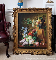 Front view of entire oil on canvas still life painting and ornate gilded frame