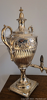 Front angle showing overall urn with handles and spigot