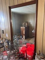Removable rectangular mirror framed in matching walnut‐tone wood.