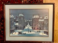 Full view of framed print showing a snowy Paris street night scene with buildings, street lamps, and horse-drawn carriages.