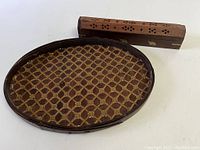 Incense holder and decorative tray together showing relative size and detail