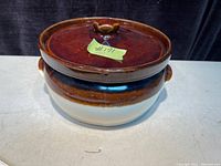 Photo of vintage pottery bean pot with lid, showing two-tone brown and cream glaze.