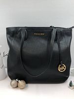 Full front view of tote handbag with handles visible, white background