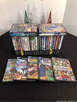 Lot overview with two stacks of GameCube cases and front row of open cases.