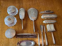 Overview of all 14 pieces laid out on wood surface