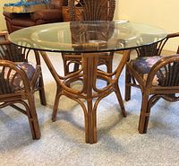 Side view of the table showing the bamboo base and the glass top above.
