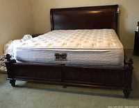 Front angle view showing entire bed frame and mattress