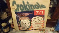 Box front label showing Crokinole 7 in 1 branding and listing all included games.