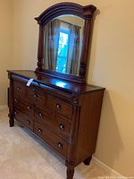 Front and side view of the dresser with the mirror mounted showing details and overall size.
