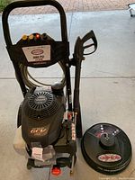 Front view of pressure washer and surface cleaner attachment