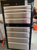 Front view of assembled double stacked tool chest and rolling cabinet with diamond plate drawers