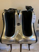 Top front view showing the dual compartments for feet and legs with control panel and power cord on top