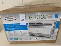 Box packaging showing Whirlpool branding and 6300 BTU cooling capacity.