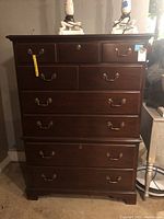 Front view of the Drexel dresser showing six drawers and brass handles.