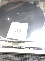 Top view of the Technics SL-B200 turntable showing the platter and dust cover with label '59' on it.