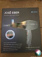 Front of Jose Eber Infusion Treatment Dryer box showing product features including nutrient infusion, AC motor, ionic generator, and included 100ml argan serum.