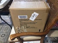 Sealed cardboard box labeled Power Airfryer Pro, 5.5qt, black color with dimensions and weight info.