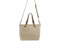 Front view of beige vegan PU tote with tortoise handle chain attachments and detachable shoulder strap.