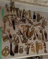 Full assortment of metal and novelty openers laid out