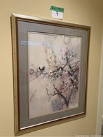 Framed print artwork hung on wall, showing overall front view and size tag 30 x 37.5.