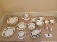 All pieces of the Brigadoon set arranged on table