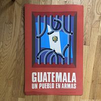 Full view of the Cuban political poster showing the Guatemalan flag behind bent metal bars with bold text.