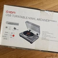 Photo of Ion Audio USB Turntable/Vinyl Archiver TTUSB10 box showing product image, model number, and checkmark for USA version.
